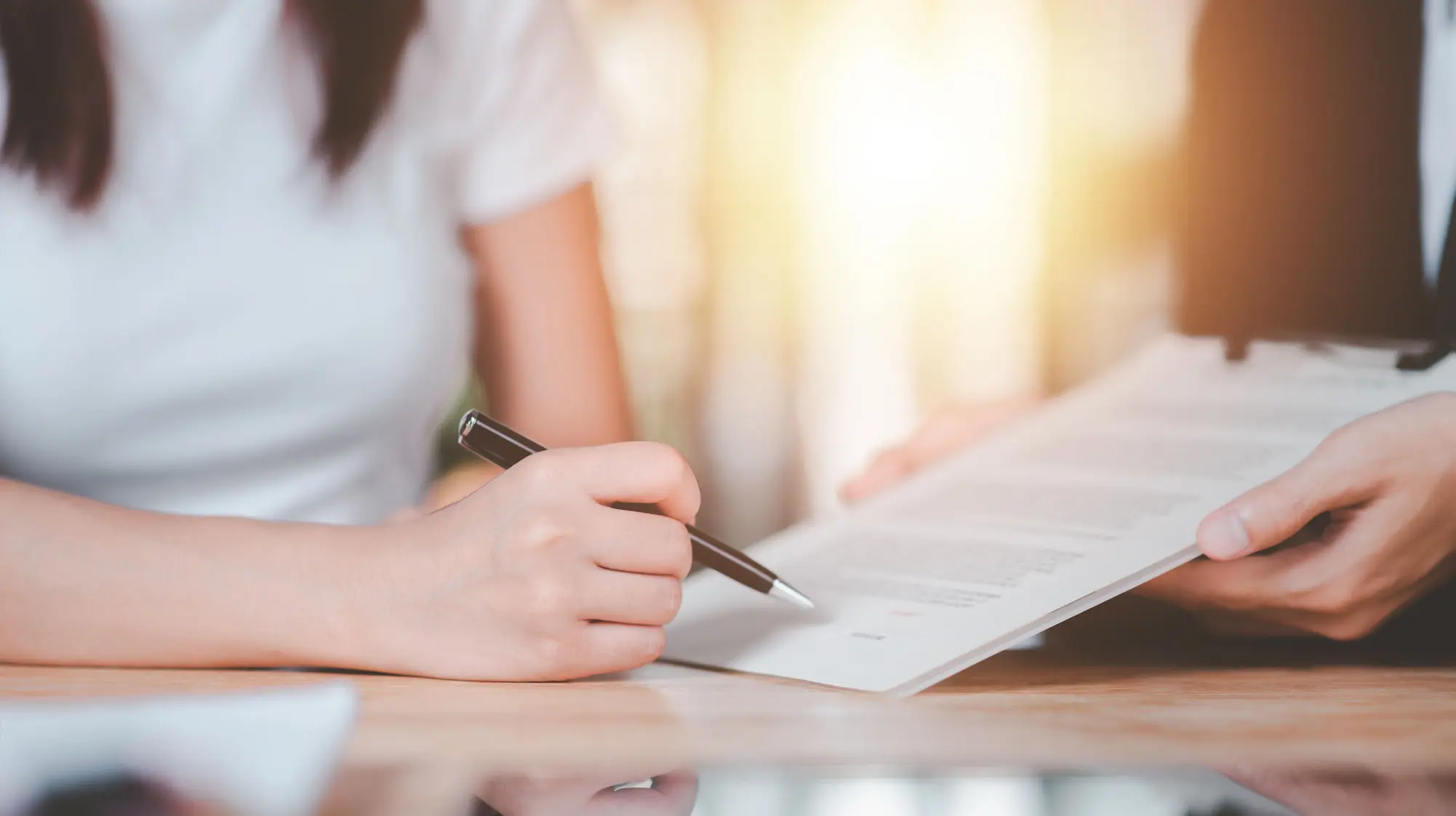 Expunction a woman signing an expunction for a criminal record